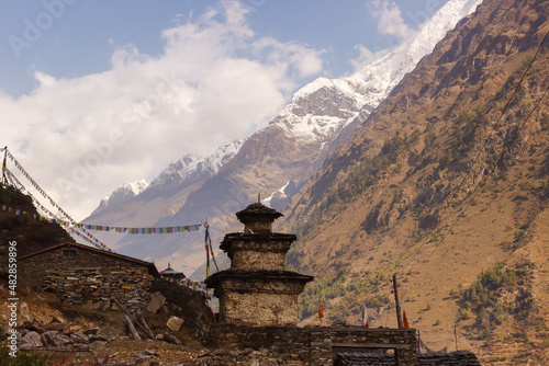 Stupa in the Manaslu region in the Himalayas with mountains in the background