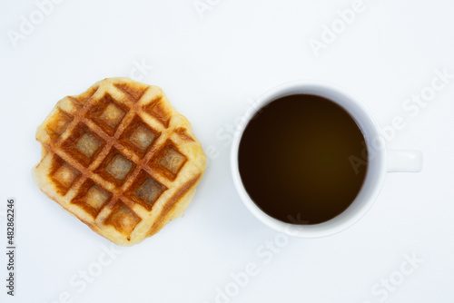 Top view of Coffee cup and waffle on white background