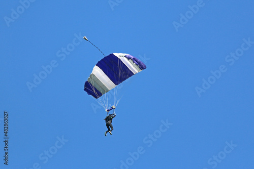 Skydiver in a blue sky 