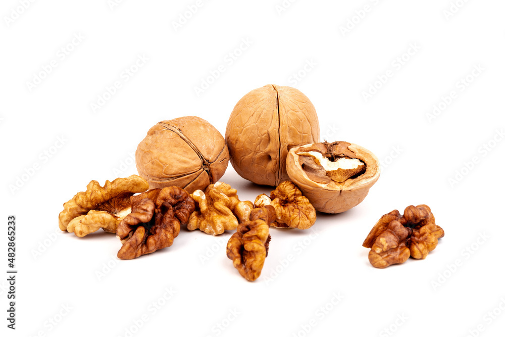 Walnuts in shells isolated on white background. Package design element with clipping path. Walnuts in shells isolated on white background. Package design element with clipping path.
