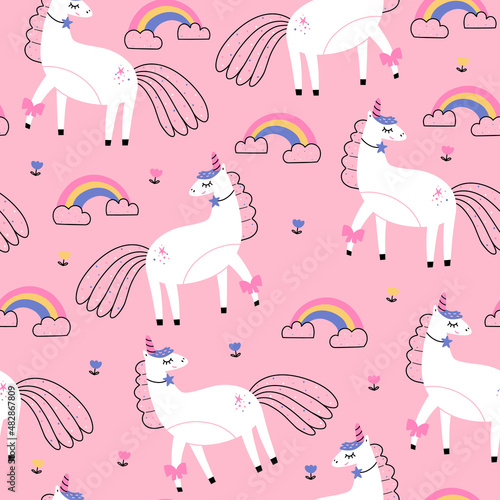 WebSeamless vector pattern with cute unicorns and rainbow on pink background. Perfect for textiles and wrapping paper. © Evartfinds