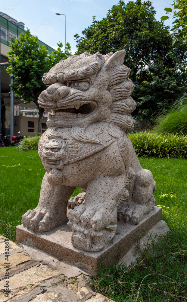 stone lion statue in the park