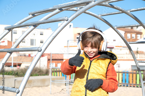 child with raised finger all perfect on the playground