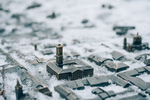 Lviv, Ukraine - January 19, 2022 : Lviv City Hall bronze miniature model with snow. Lviv tourist attraction for winter season photo