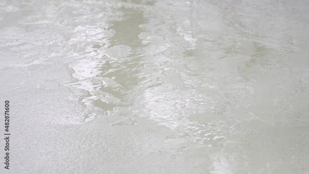 Water running over melting Ice on a spring river. Water running over melting Ice on a spring river.