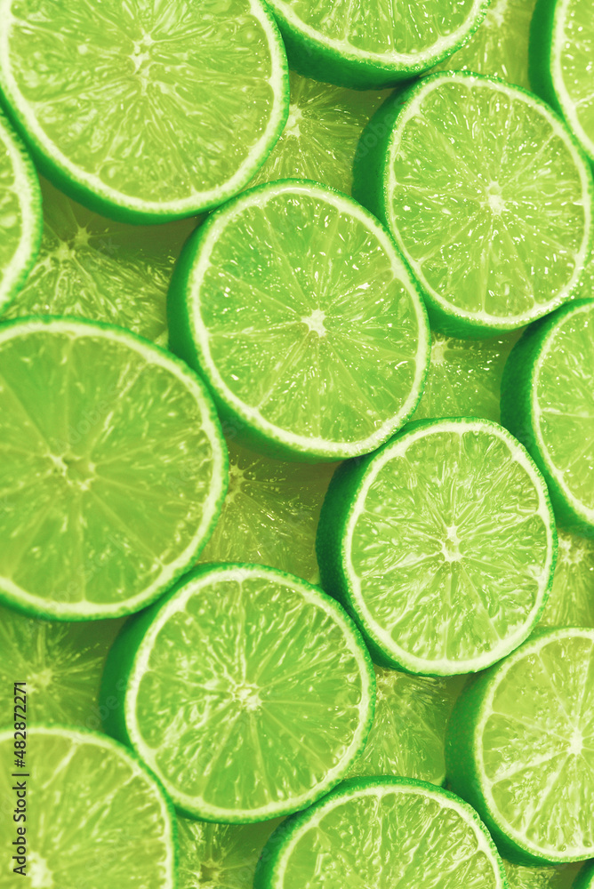 Fresh lime slices as a background.