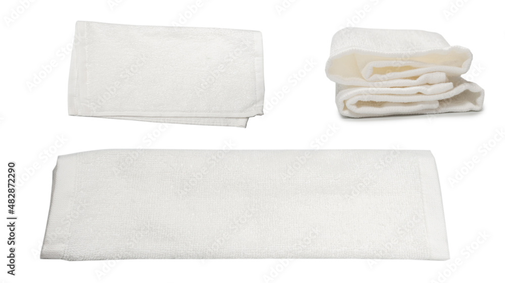 White fluffy cotton towel isolated on a white background. White fluffy cotton towel isolated on a white background.