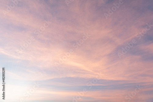 Summer Blue Sky and white clouds background. Beautiful clear cloudy in sunlight sunset season. Panorama vivid pink cloudscape in nature environment. Outdoor horizon skyline with spring sunshine. © Art Stocker
