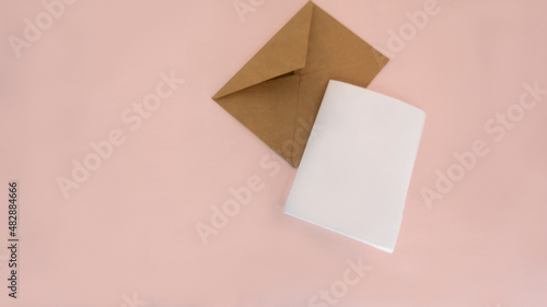 Blank card greeting card on pink isolate craft paper letters top white sheet mockup for design