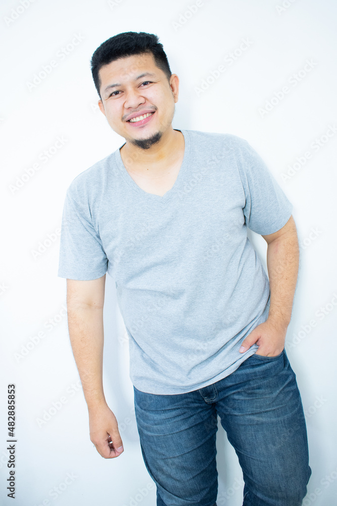 Close up portrait of young man with hands behind head Close up portrait of young man with hands behind head