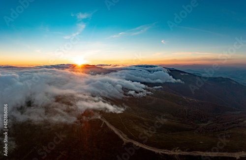 Mountain highlands with trees in autumn forest at sunrise