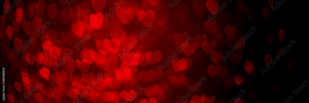 Red hearts, sparkling glitter bokeh background texture. Holiday valentines day lights. Abstract defocused header. Wide screen wallpaper. Panoramic web banner with copy space for design Red hearts, sparkling glitter bokeh background texture. Holiday valentines day lights. Abstract defocused header. Wide screen wallpaper. Panoramic web banner with copy space for design