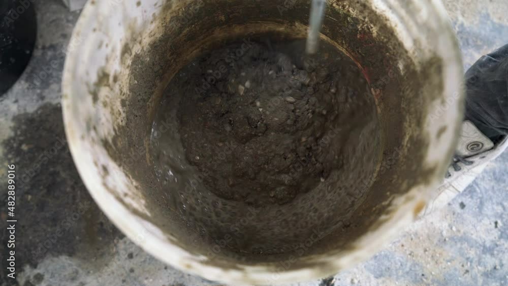 Mixing Concrete In Bucket With Electric Mixer Mixing Concrete In Bucket With Electric Mixer