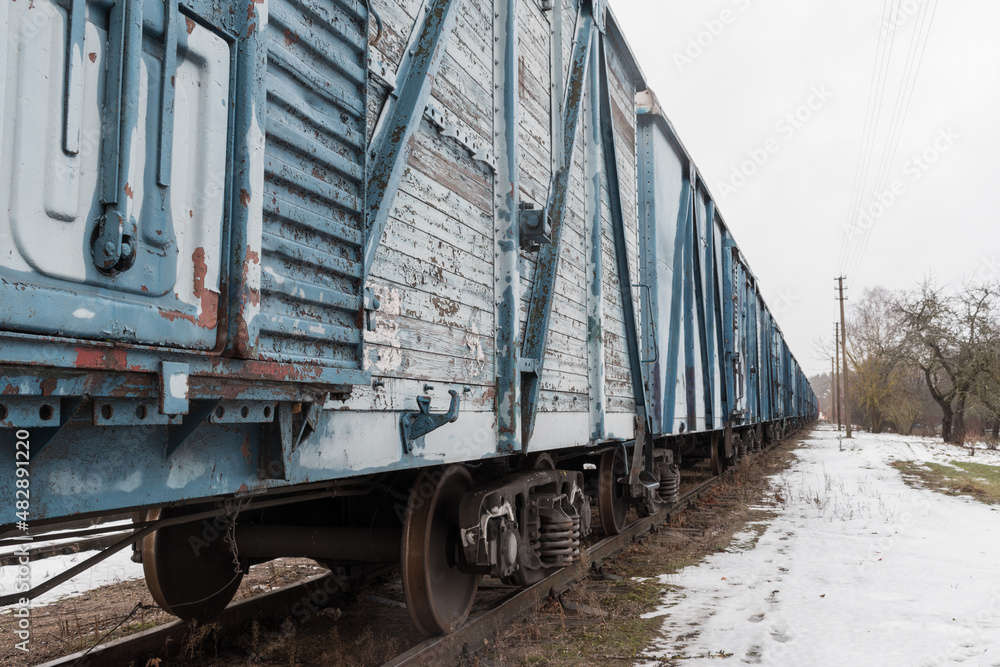 Fototapeta premium Blue freight train in winter.