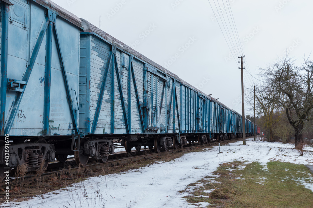 Obraz premium Blue freight train in winter.