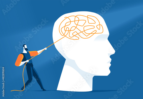Uomo tira un filo che si è intrecciato nel cervello umano