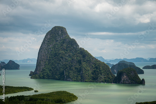 View from above, aerial view of the beautiful Phang Nga Bay (Ao Phang Nga National Park) with the sheer limestone karsts that jut vertically out of the emerald-green water, Thailand photo