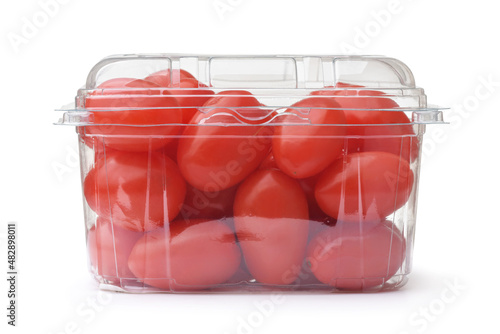 Ripe plum tomatoes in clear plastic container