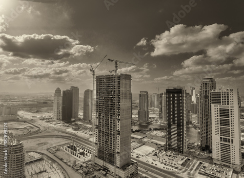 Aerial skyline of Dubai Marina. Skyscrapers and canal on a sunny day  UAE