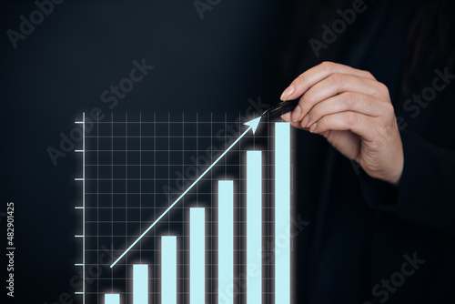 planning and strategy, Stock market, Business growth, progress or success concept. Hand of Businessman or trader touching showing a growing virtual hologram stock on smartphone, invest in trading
