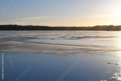 Sunset at frozen lake