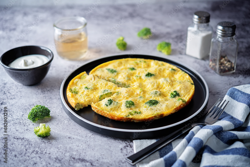 Broccoli Frittata in a plate with sauce