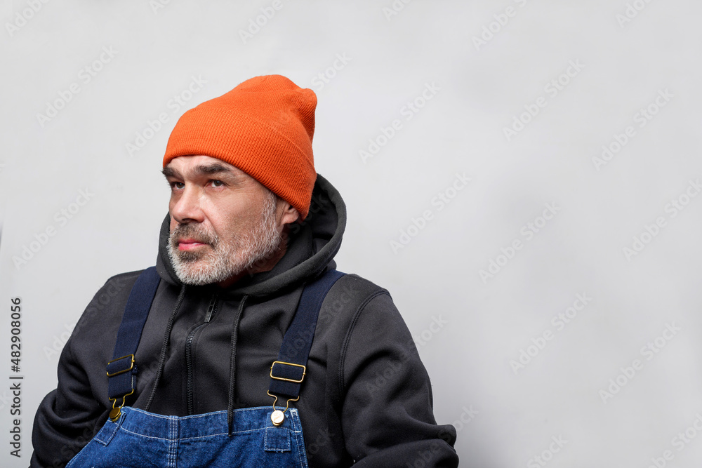 Portrait of a male worker in overalls. Bluecollar man Portrait of a male worker in overalls. Bluecollar man