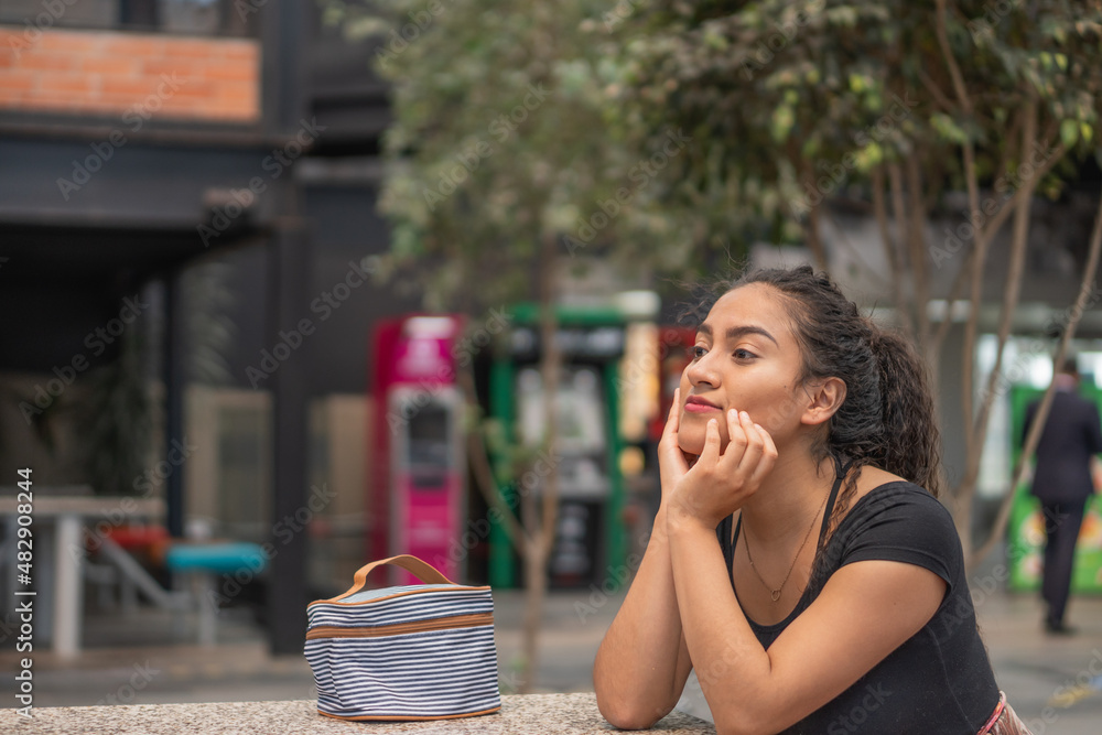 Young woman waiting in a public place. Young woman waiting in a public place.