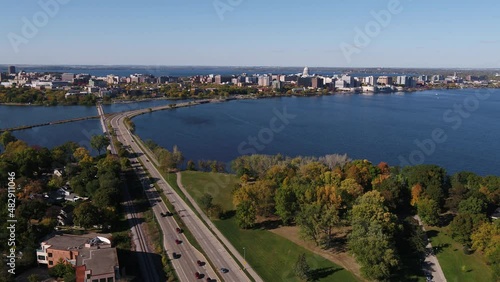 Flying Over John Nolen Drive towards Downtown Madison, Wisconsin Surrounded by Fall Colors (Drone - Push In)