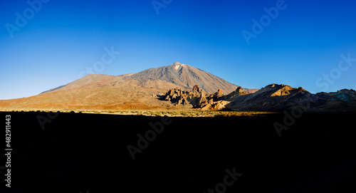 impressive view of the Teide volcano with the snowy peak in the bright morning.