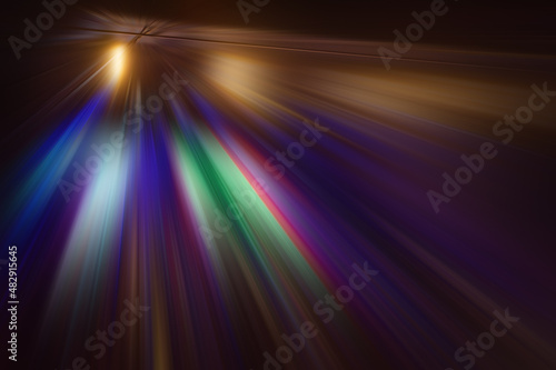 Radial multicolored rays on a dark, abstract background.
