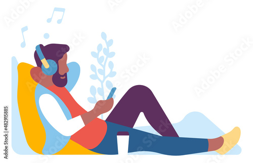 Man sitting with music in headphones. Leisure time concept