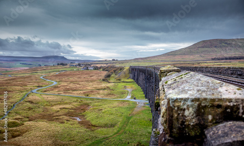 Ribblehead Viaduct - Taken from trackside - Iconic 19th-century railway viaduct noted for its photogenic span of 24 stone arches - Carnforth - Yorkshire Dales, England photo