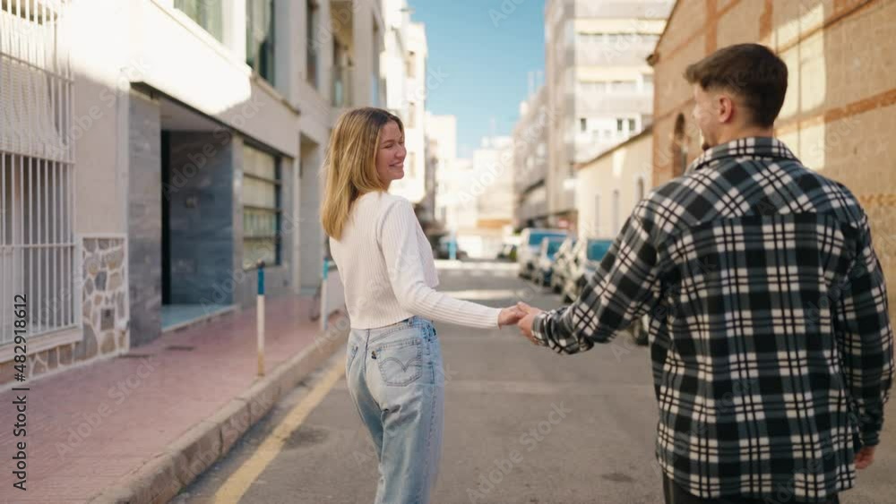 Young couple smiling confident hugging each other at street Young couple smiling confident hugging each other at street