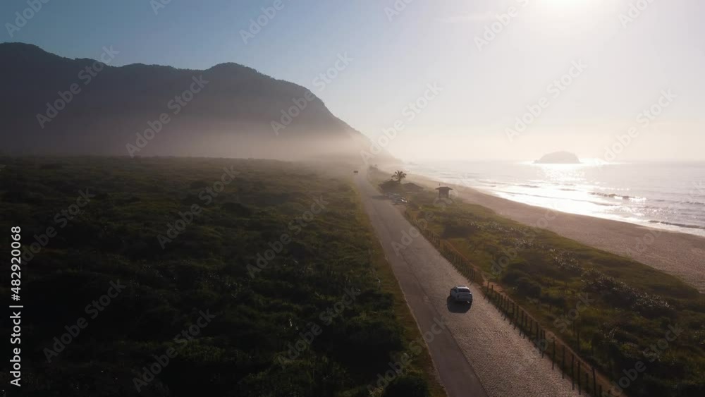 Aerial view of Grumari Beach, a paradise in the west side of Rio de Janeiro, Brazil. Big hills around. Sunny day at dawn. Drone take. Aerial view of Grumari Beach, a paradise in the west side of Rio de Janeiro, Brazil. Big hills around. Sunny day at dawn. Drone take.