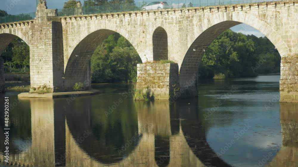Roman Bridge, Ponte da Barca, Portugal. Panement revealing the small chartered town Roman Bridge, Ponte da Barca, Portugal. Panement revealing the small chartered town