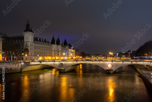 Night Paris, Pont au Change, reflection of lights in the river Seine, cityscape