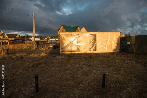 Delivery and installation of a modular frame house. Frame construction of small houses. Modular housing construction. Your house. An inexpensive house.