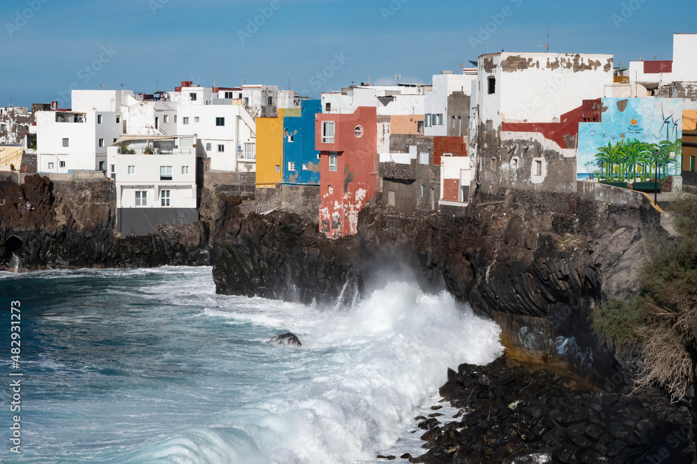 View on colorful houses and black lava rocks in small village Punta Brava near Puerto de la Cruz, Tenerife, Canary islands