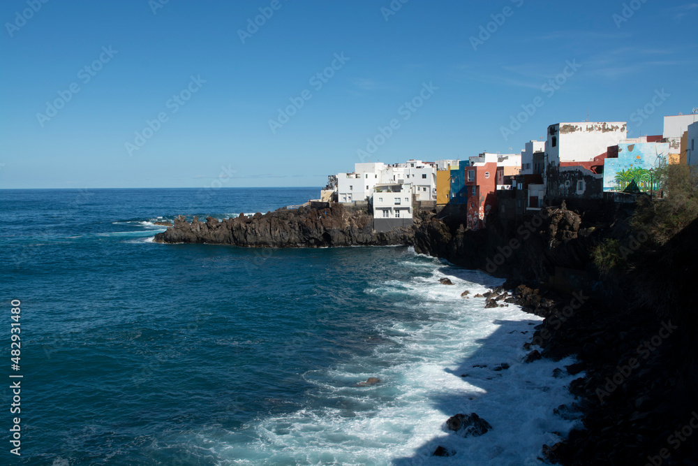View on colorful houses and black lava rocks in small village Punta Brava near Puerto de la Cruz, Tenerife, Canary islands