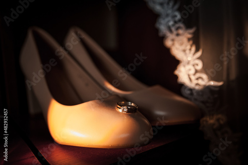 Bride's shoes, gold rings. Morning of the bride. Wedding details
