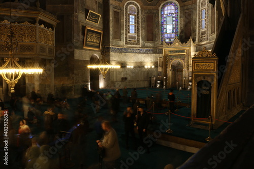 selective focus. istanbul: local and foreign tourists visiting the historical Hagia Sophia mosque with its magnificent architecture visit the mosque and pray.