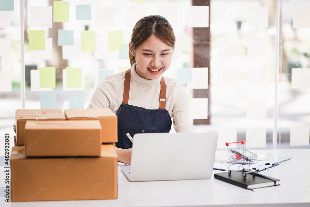Small start-up business owners checking parcels at work, salespeople, checking production orders. Pack products for delivery to customers Sell Ecommerce Shipping Ideas Small start-up business owners checking parcels at work, salespeople, checking production orders. Pack products for delivery to customers Sell Ecommerce Shipping Ideas