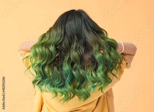 Bild auf Leinwand Beautiful young woman with unusual green hair on color background
