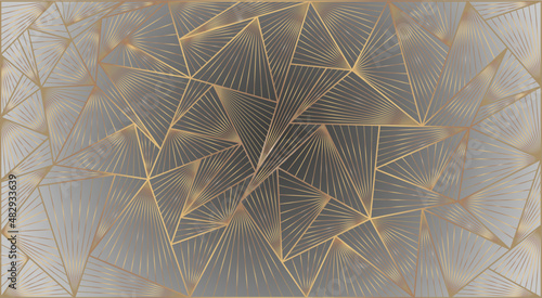 
Luxury unique background, golden graphic wallpaper. Triangles of different sizes with a texture of golden lines create a combination on a dark gray background with backlighting around the edges.