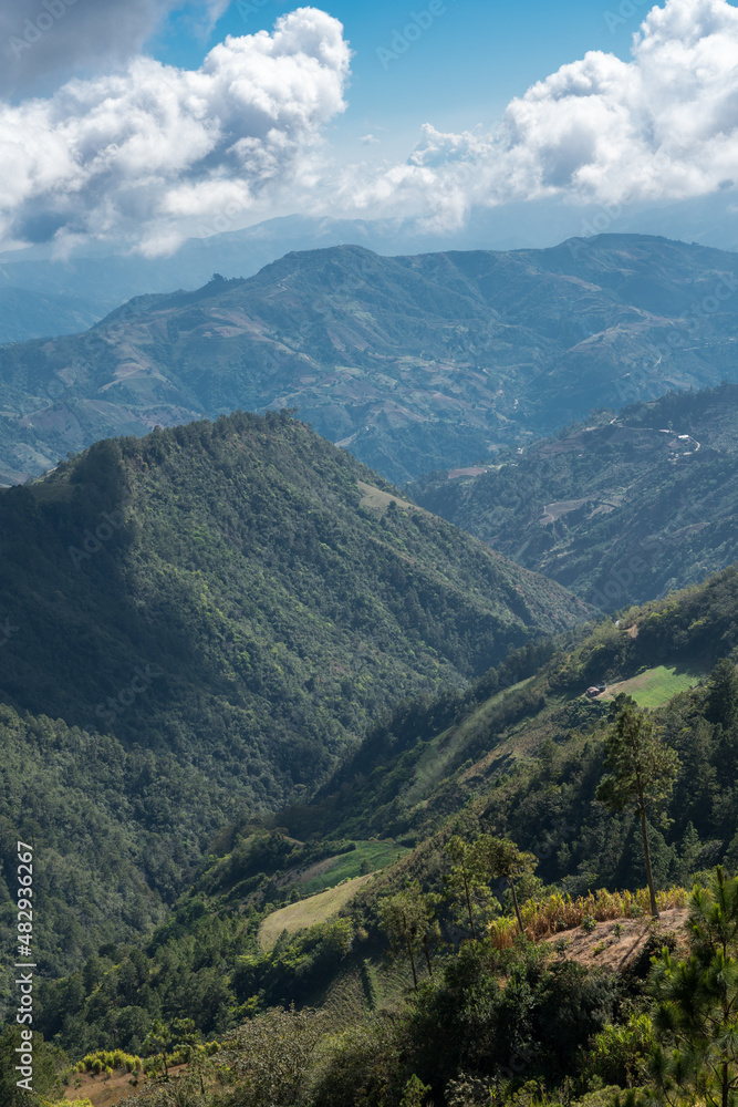 Dramatic image of a small farm and agricultural fields high in the Caribbean mountains of Dominican Republic.