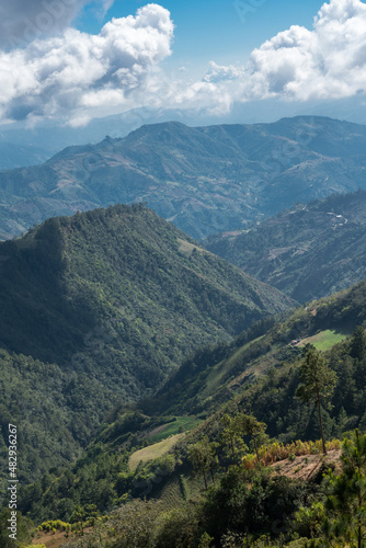 Dramatic image of a small farm and agricultural fields high in the Caribbean mountains of Dominican Republic.