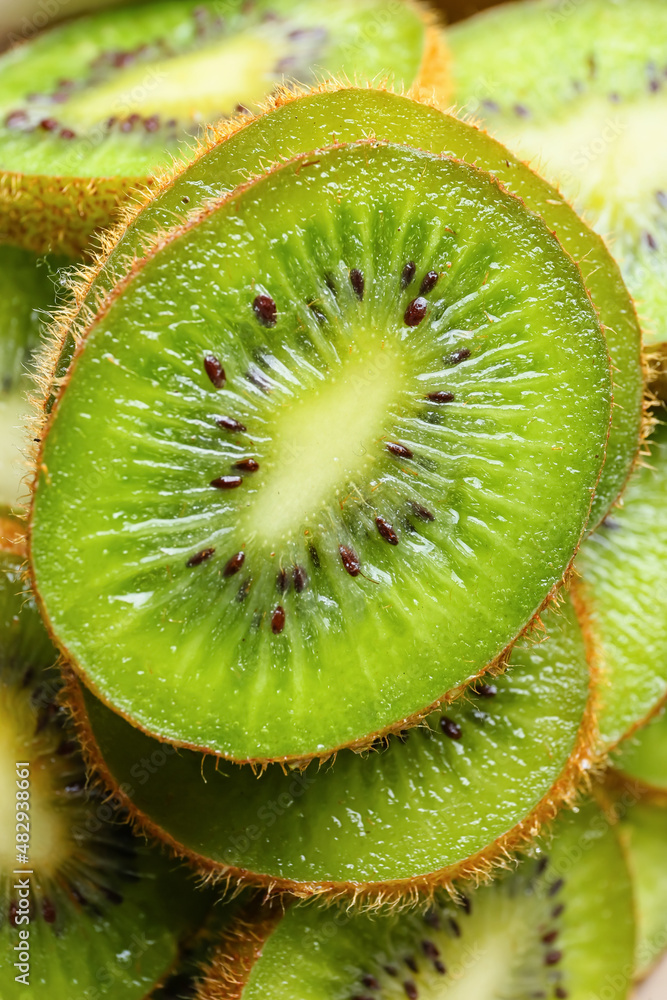 Slices of fresh kiwi as background, closeup Slices of fresh kiwi as background, closeup