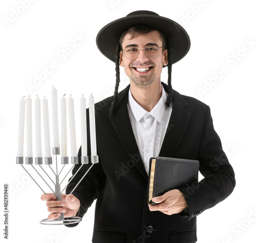 Obraz na plátně Jewish man with Torah and menorah on white background