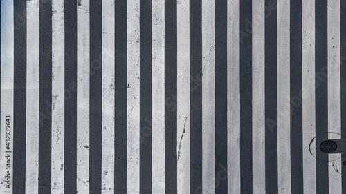 Aerial view over old and broken pedestrian crossing road intersection of Japan